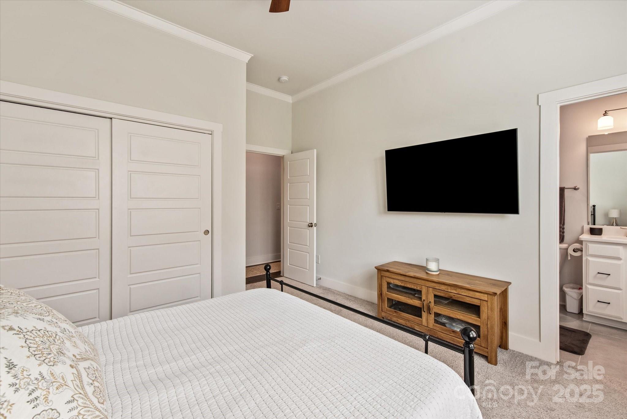 1244 Weir Court Fort Mill, SC 29708 - Photo 14 of 48 a bedroom with a bed and a flat screen tv