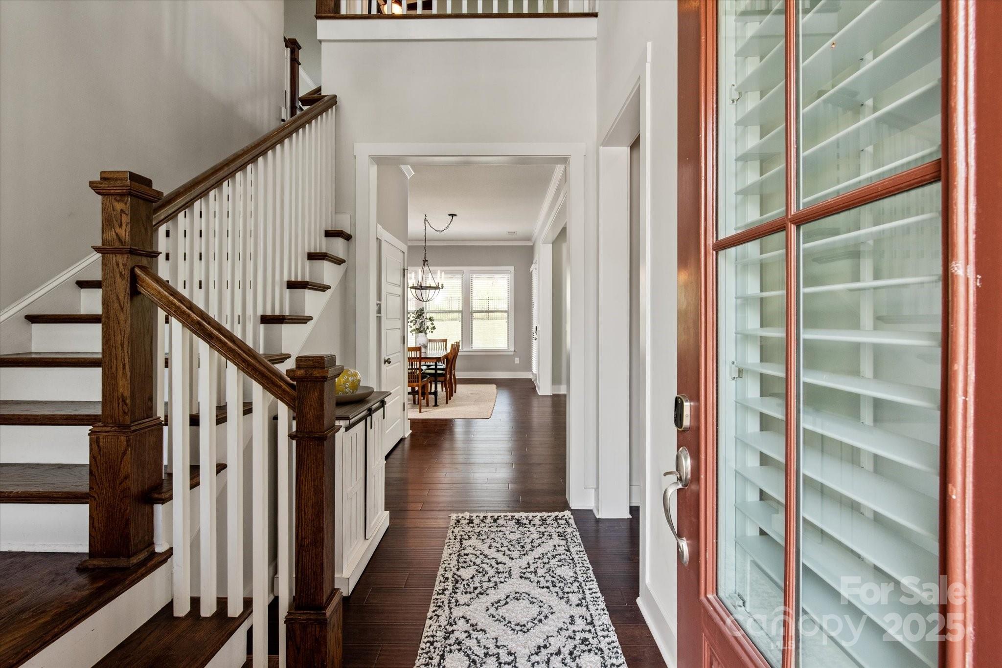 1244 Weir Court Fort Mill, SC 29708 - Photo 3 of 48 a view of a hallway with wooden floor and staircase