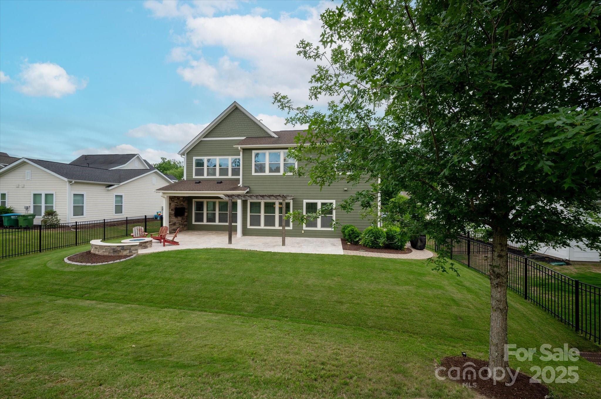 1244 Weir Court Fort Mill, SC 29708 - Photo 34 of 48 a view of a house with a big yard and potted plants and large trees