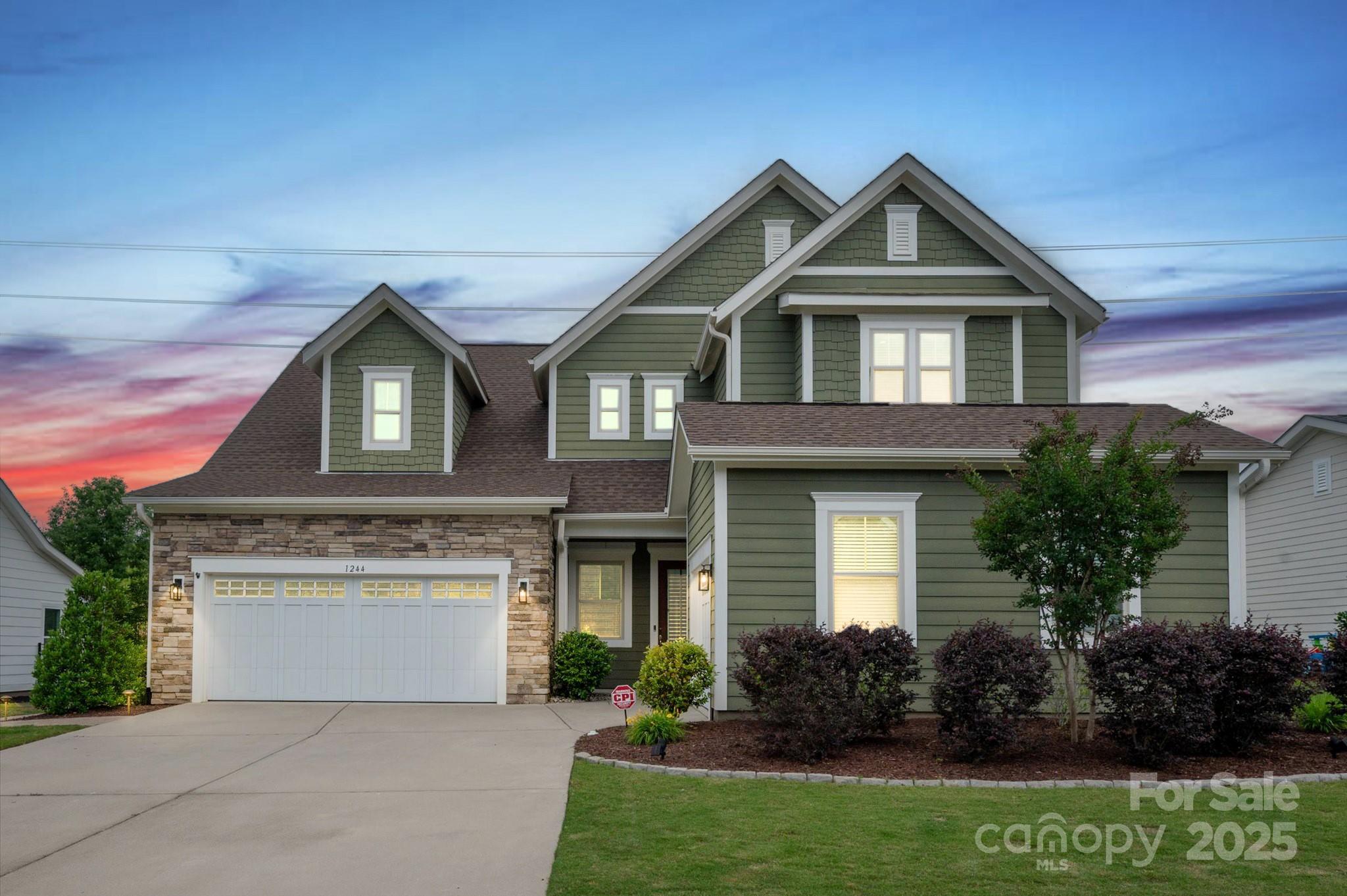 1244 Weir Court Fort Mill, SC 29708 - Photo 48 of 48 a front view of a house with a garden