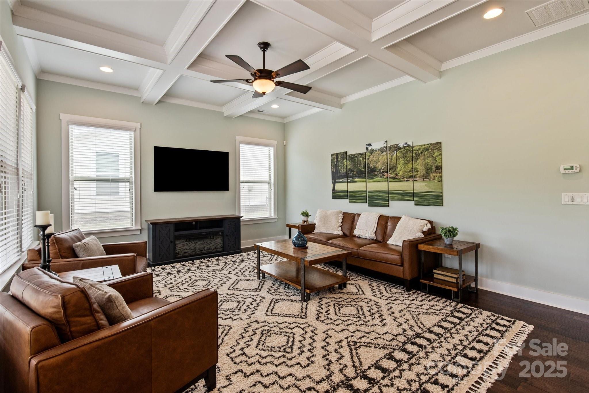 1244 Weir Court Fort Mill, SC 29708 - Photo 6 of 48 a living room with furniture a flat screen tv and a fireplace