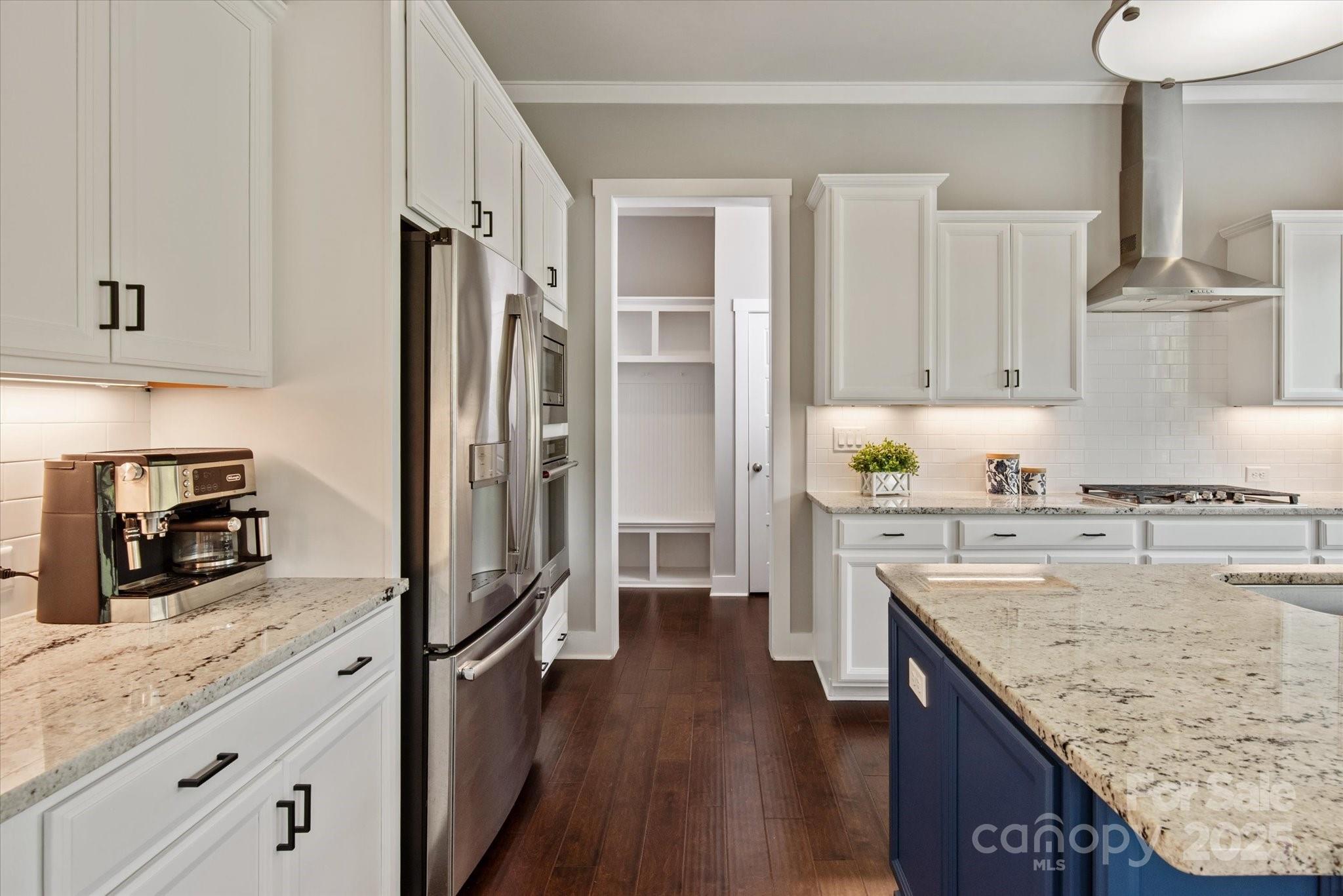 1244 Weir Court Fort Mill, SC 29708 - Photo 7 of 48 a kitchen with granite countertop kitchen island wooden cabinets and stainless steel appliances