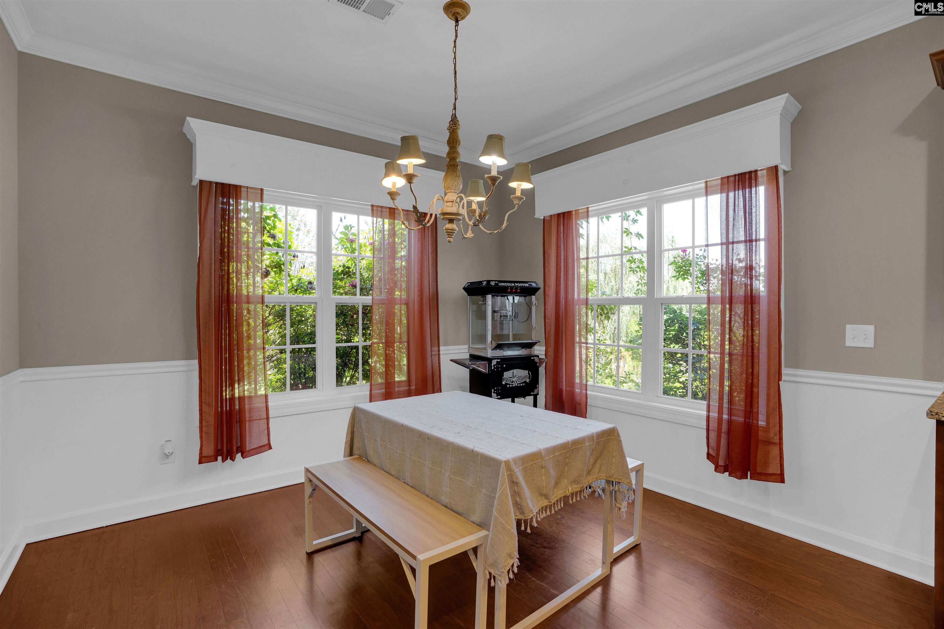 321 Asa Rose Lexington, SC 29072 - Photo 13 of 52 a living room with furniture and a chandelier