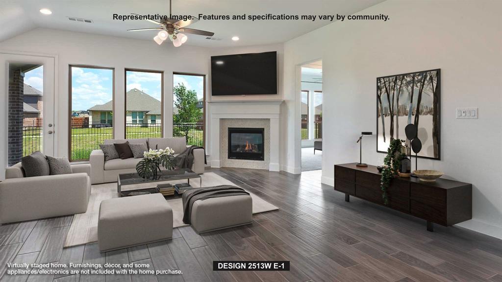 3520 Bear Street Forney, TX 75126 - Photo 7 of 12 a living room with furniture a fireplace and a flat screen tv