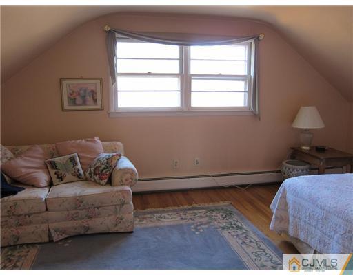 11 Timber Road Edison, NJ 08820 - Photo 14 of 17 a living room with furniture and a window