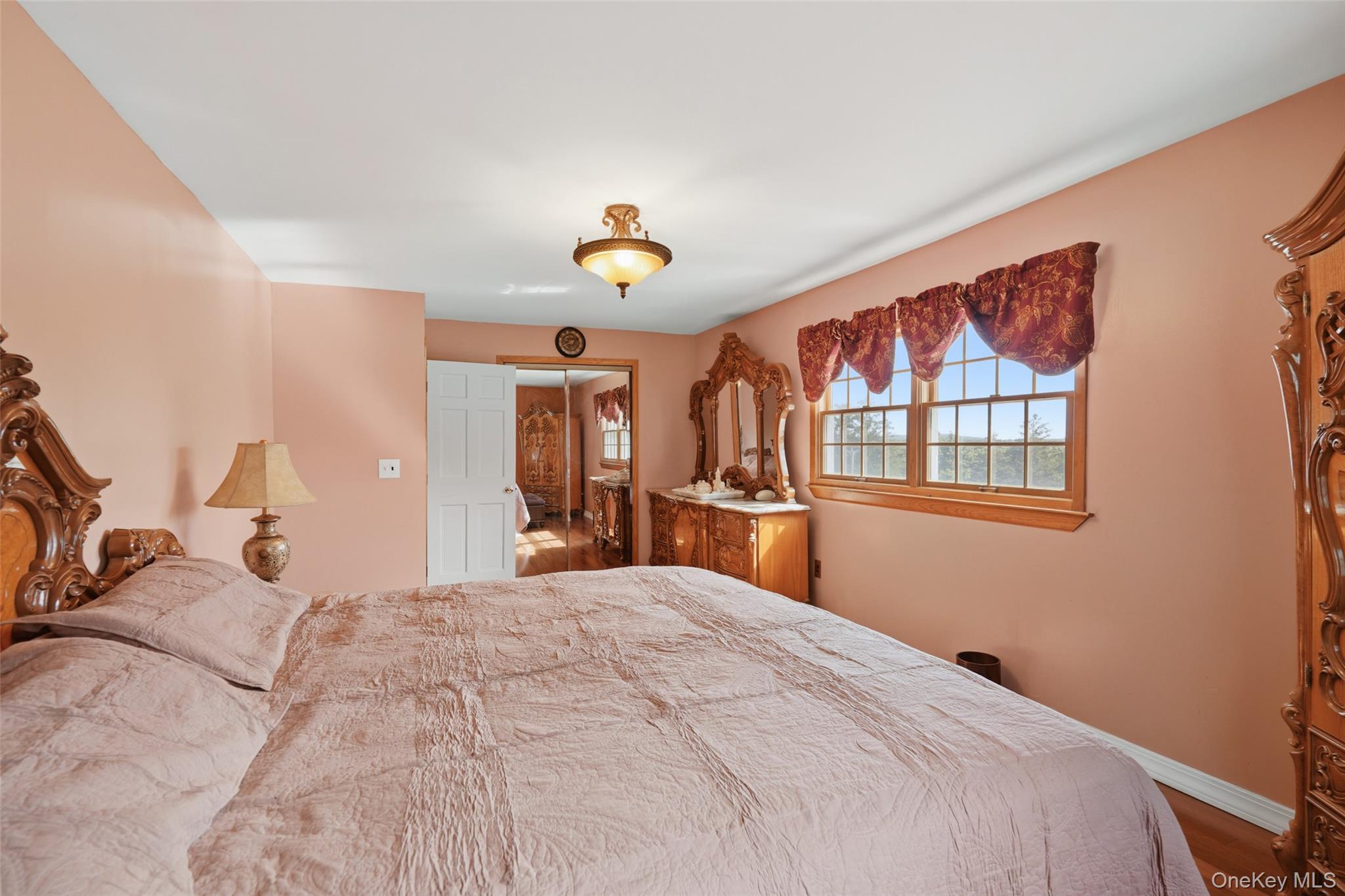 623 Cardinal Road Cortlandt Manor, NY 10567 - Photo 22 of 40 a bedroom with a large bed and a window