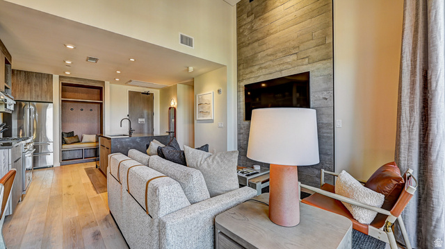 2417 West High Road, Unit 2515 Park City, UT 84098 - Photo 3 of 67 Living room featuring light wood finished floors, recessed lighting, and a high ceiling