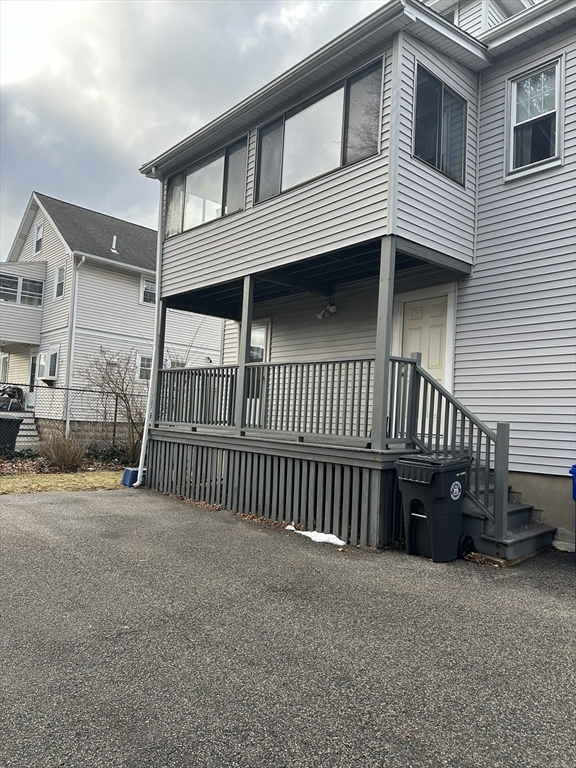 33 Amsden Street, Unit 1 Arlington, MA 02474 - Photo 13 of 18 a view of a house with iron fence