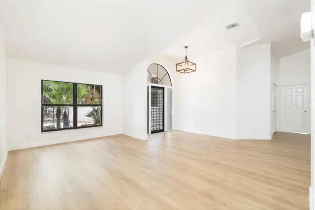 a view of an empty room with a window