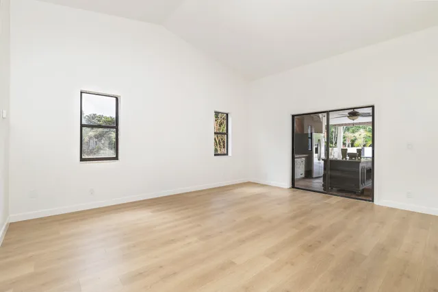 a spacious bathroom with a tub sink and mirror