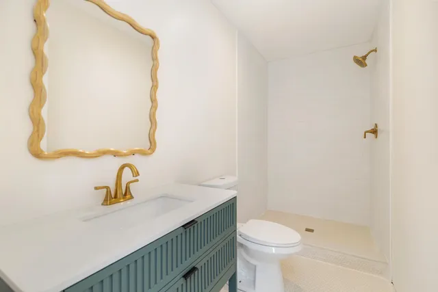 a view of a patio with a table and chairs