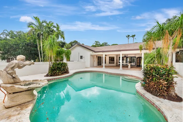 a view of a swimming pool with a patio