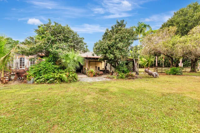 an aerial view of a house with outdoor space