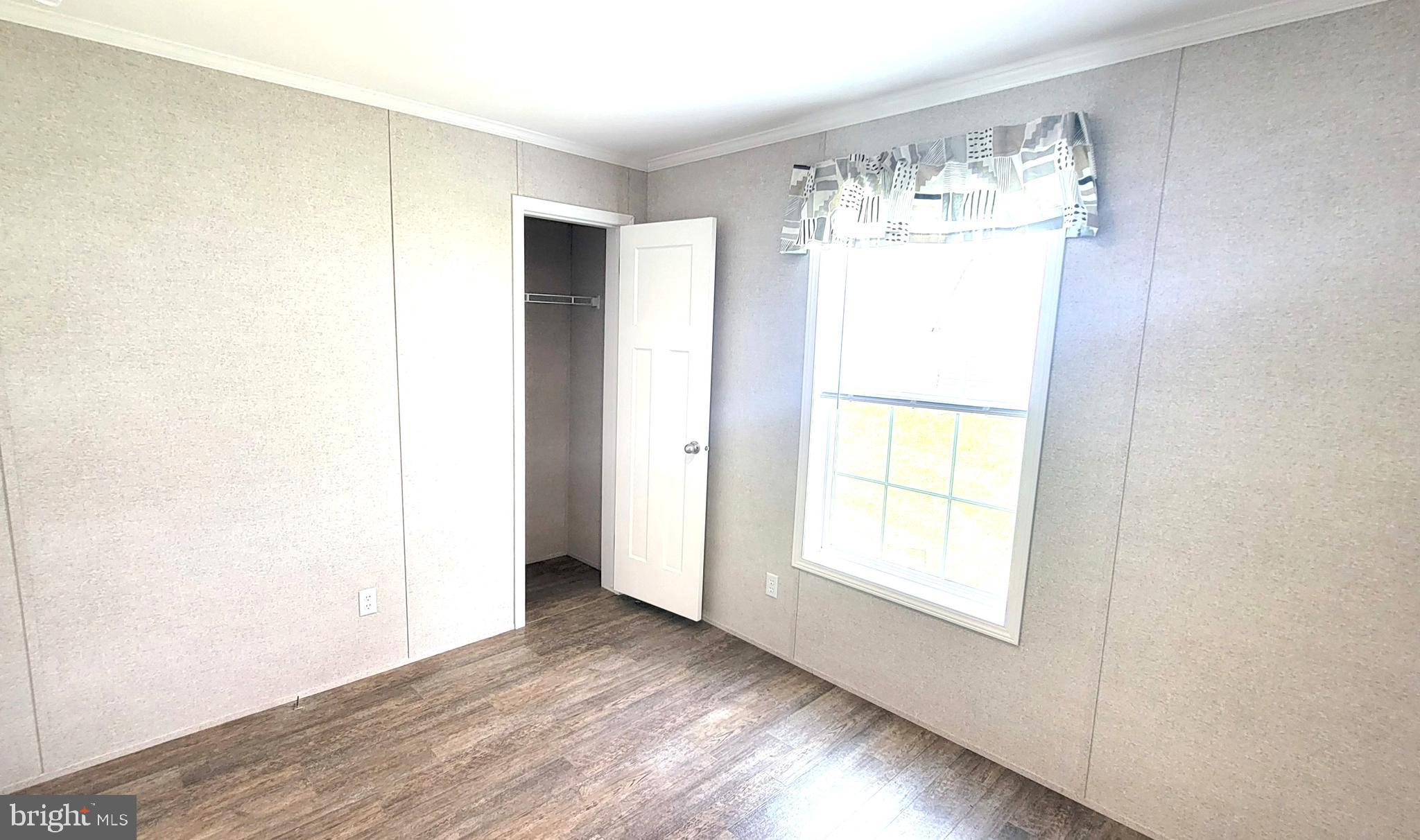 4 Joseph Avenue Birdsboro, PA 19508 - Photo 15 of 19 a view of an empty room with wooden floor and a window