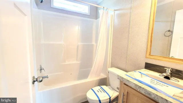 a bath room with a sink and a bath tub