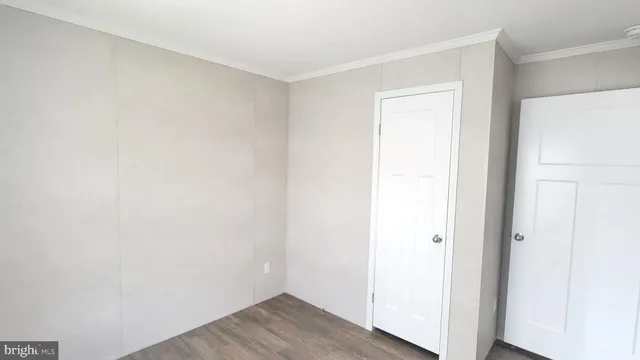 a view of a small space with wooden floor