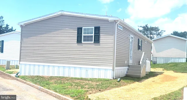 a view of a house with a yard and garage