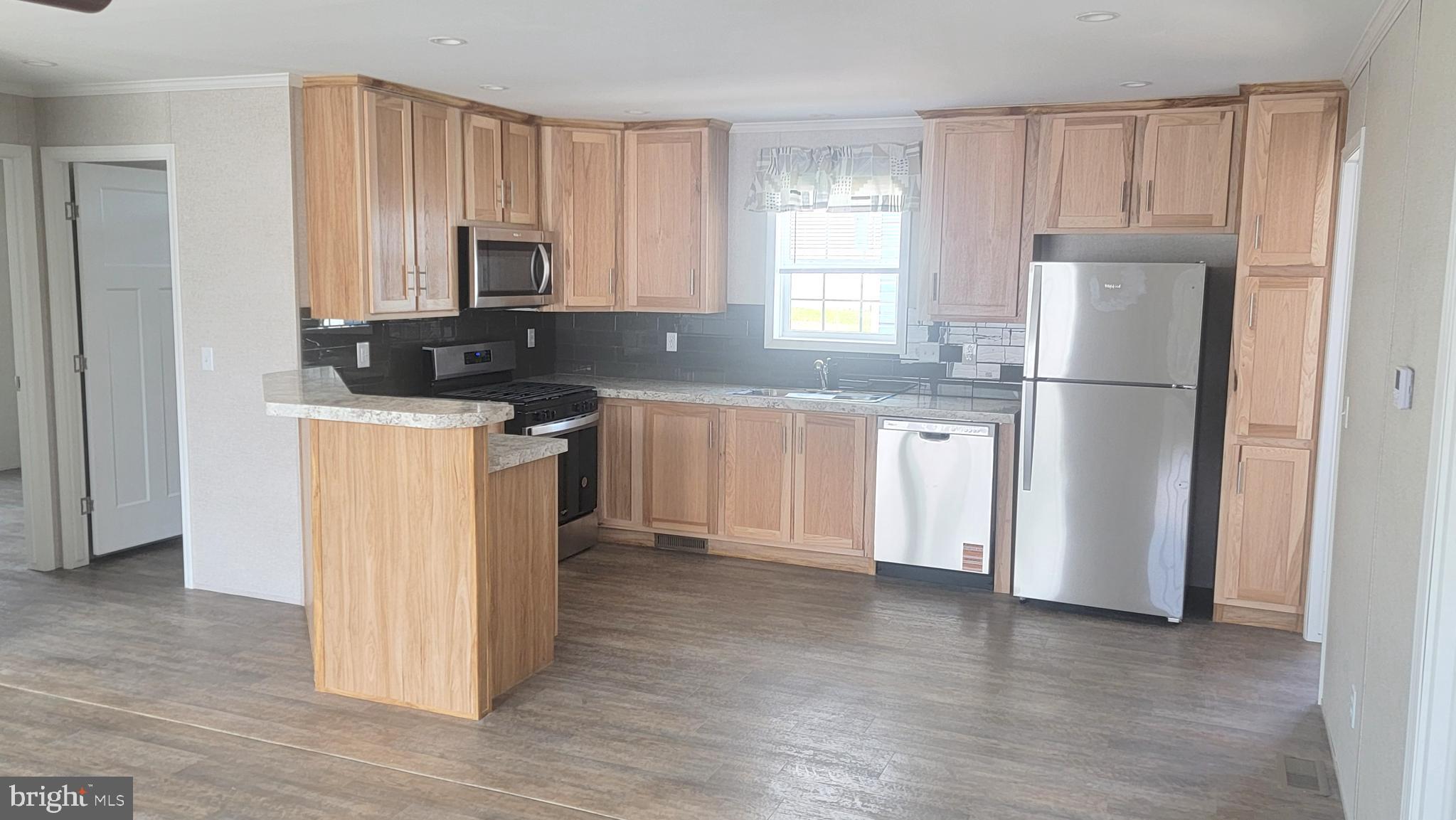4 Joseph Avenue Birdsboro, PA 19508 - Photo 6 of 19 a kitchen with a refrigerator a stove a sink and cabinets