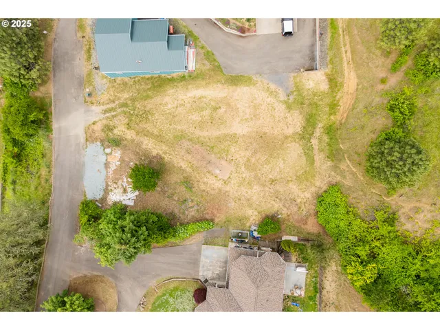 aerial view of a house with a lake view