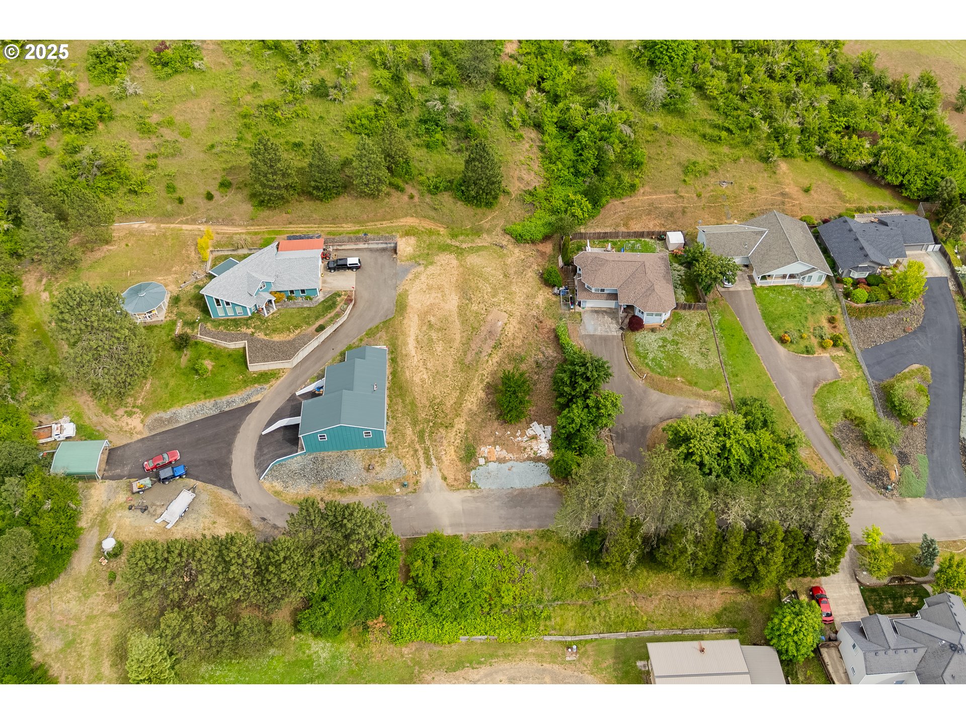 1140 Arburnia Street Myrtle Creek, OR 97457 - Photo 10 of 14 an aerial view of a house with a yard basket ball court and outdoor seating