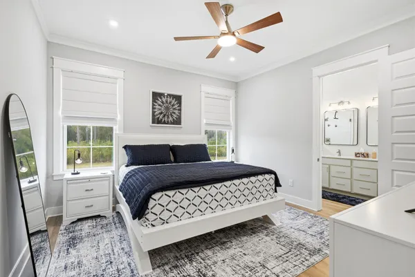 a bedroom with a large bed and a flat screen tv