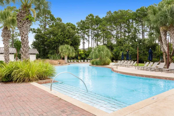 a view of a swimming pool with a patio