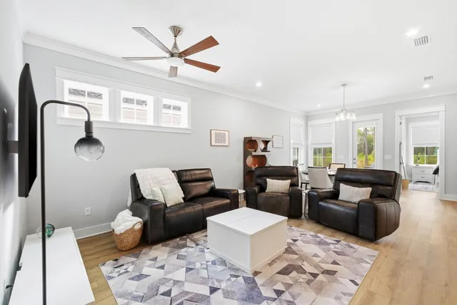 a living room with furniture and a rug