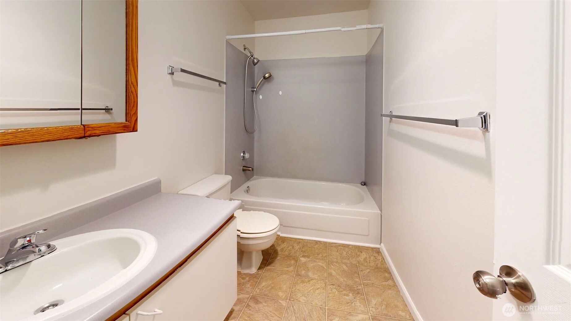 29645 18th Avenue South, Unit A303 Federal Way, WA 98003 - Photo 18 of 19 a bathroom with a sink toilet and shower