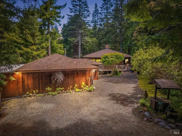 a view of patio with a table and chairs under an umbrella