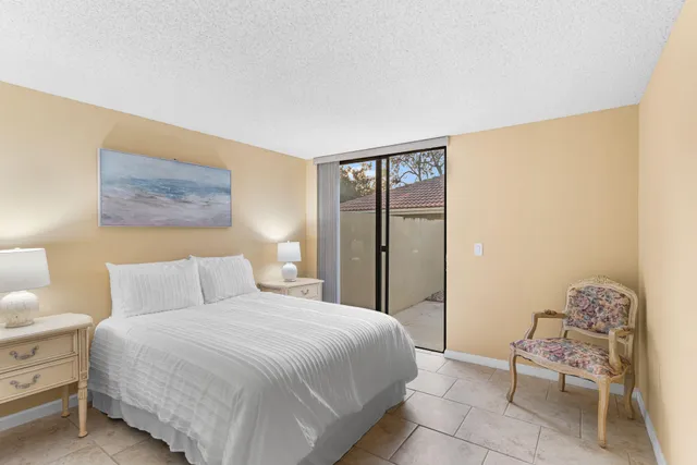 a bedroom with a bed and a chair