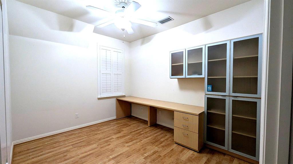 4209 Sexton Lane Dallas, TX 75229 - Photo 20 of 27 a view of an empty room with a window and wooden floor