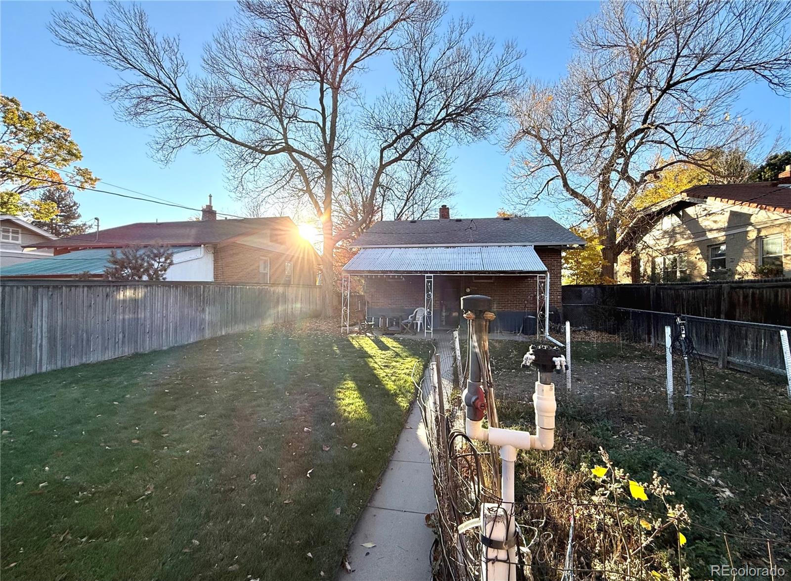 1440 South Race Street Denver, CO 80210 - Photo 12 of 17 a view of a chairs and table in the patio