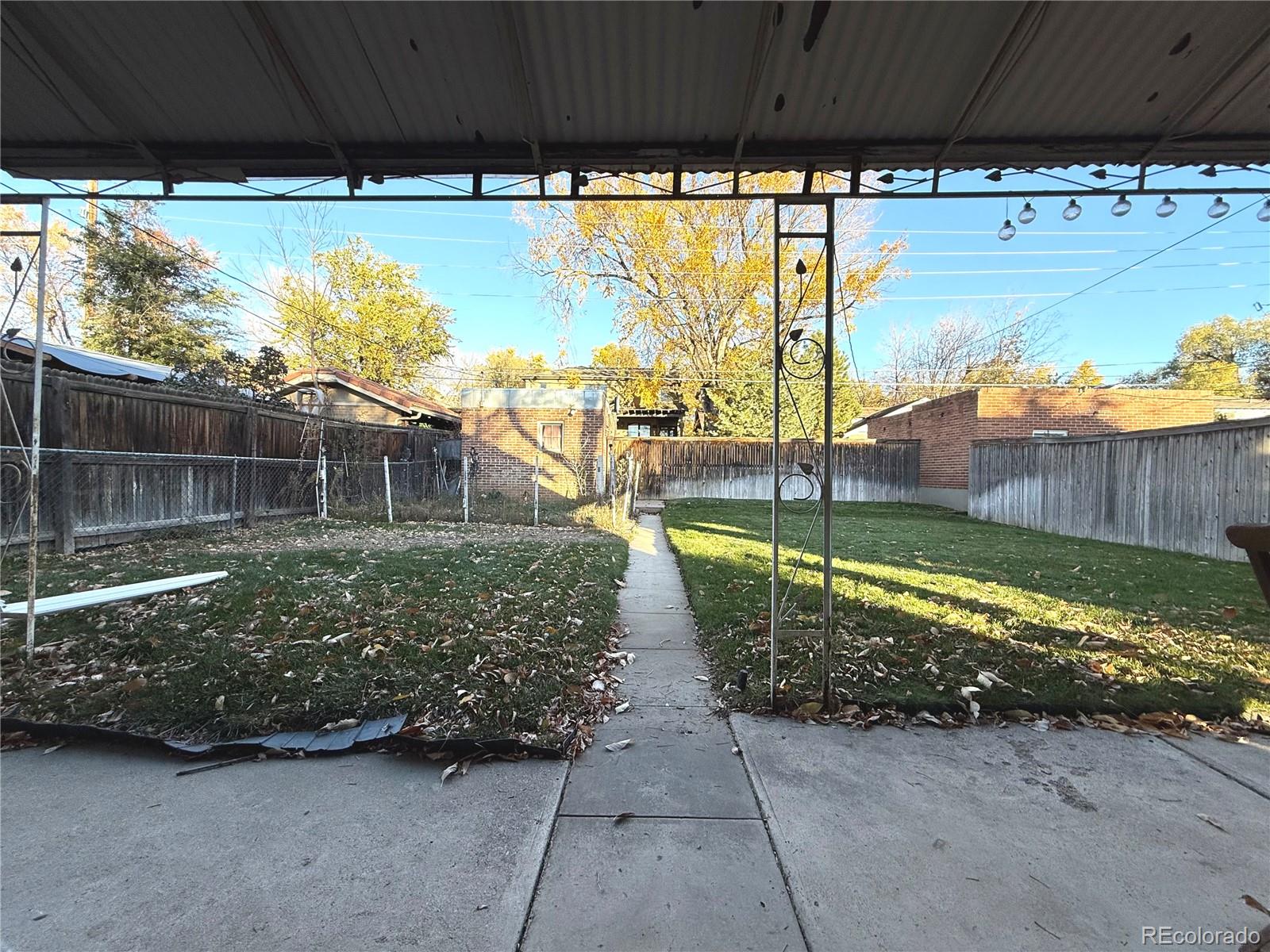 1440 South Race Street Denver, CO 80210 - Photo 13 of 17 a view of a backyard with swimming pool
