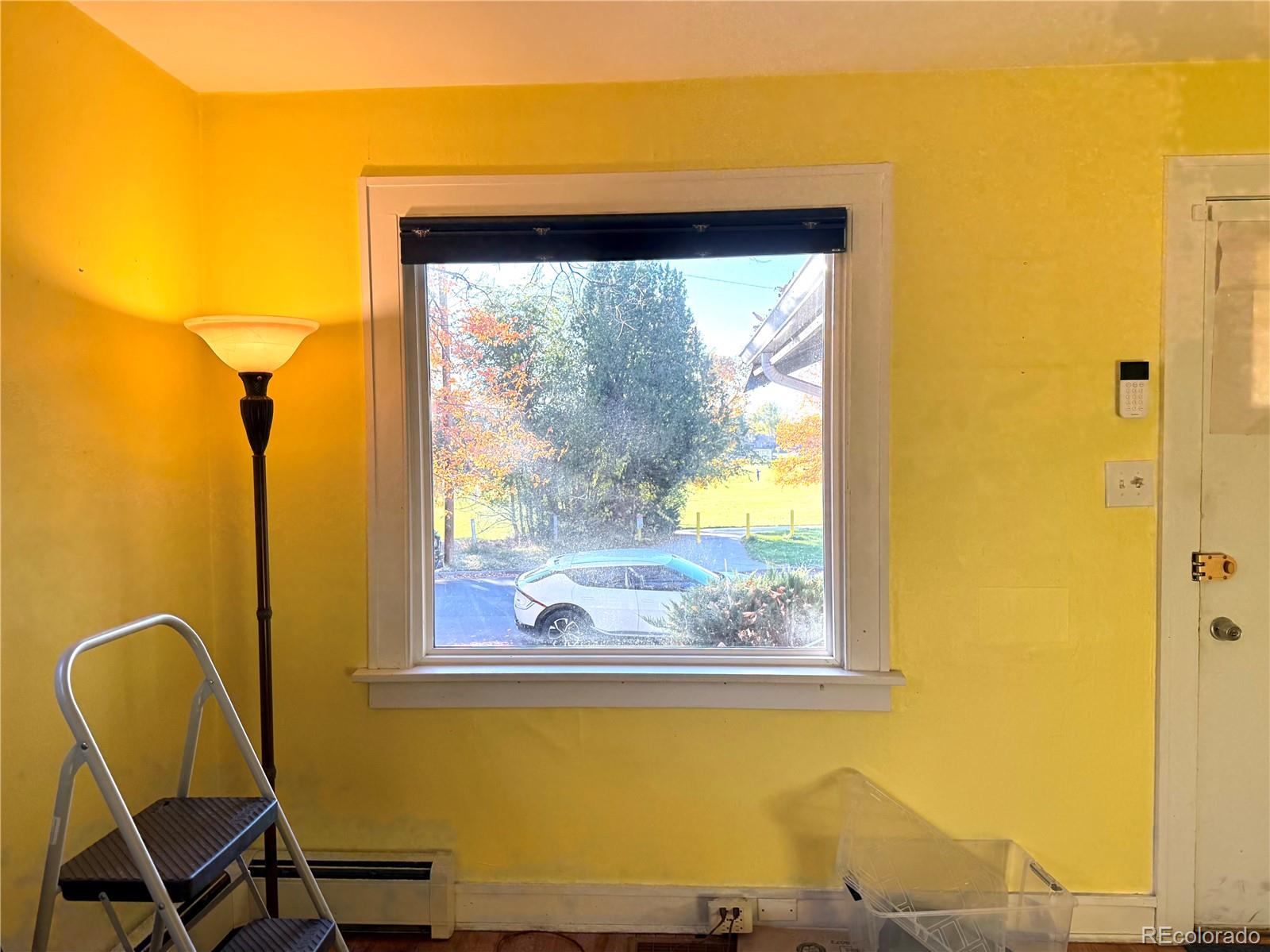 1440 South Race Street Denver, CO 80210 - Photo 15 of 17 a view of a door and chair in the room