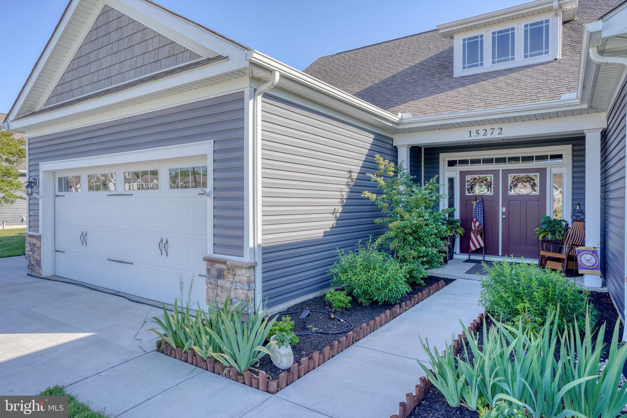 15272 Crape Myrtle Road Milton, DE 19968 - Photo 16 of 61 Charming curb appeal with lush greenery.