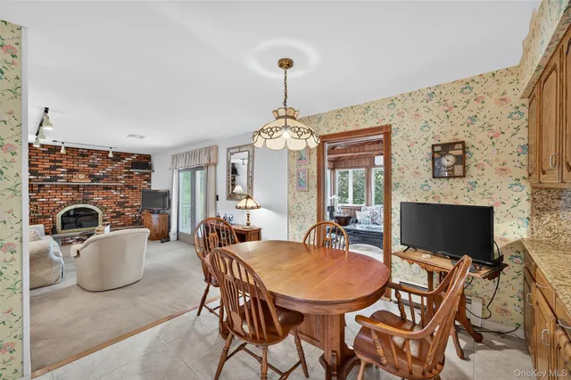 a bedroom with a bed and a lamp on the dresser