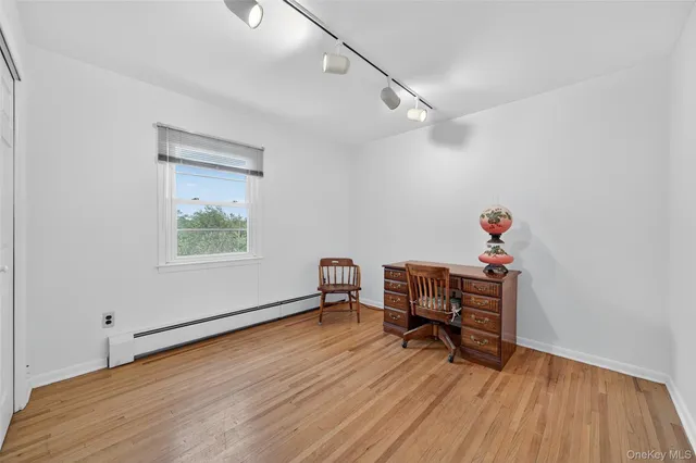 a bedroom with two beds and a window