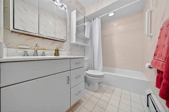 a bathroom with a sink a mirror and a toilet