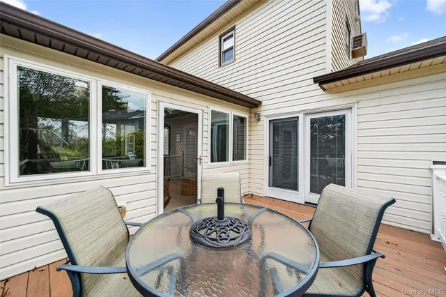 a view of yard with swimming pool and green space