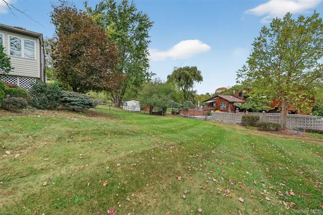 front view of a brick house with a large window