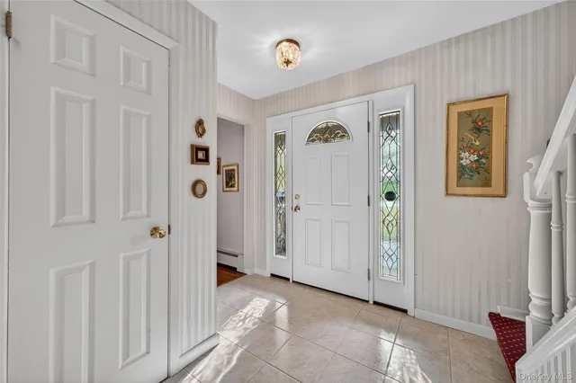 a living room with furniture rug and wooden floor