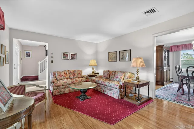 a open kitchen with stainless steel appliances granite countertop a sink dishwasher a stove a refrigerator and island with wooden cabinets