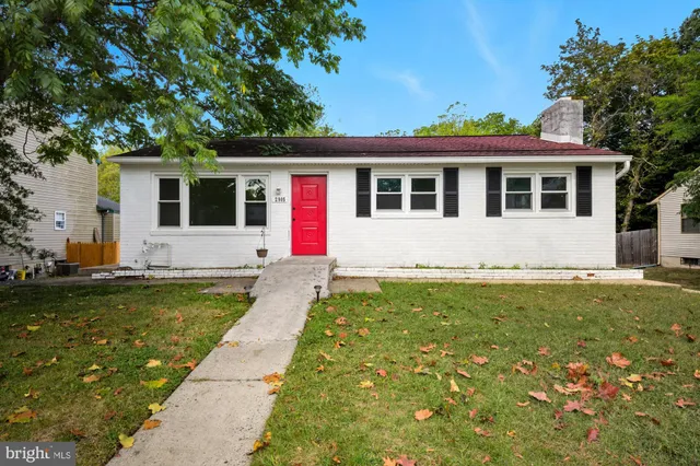 a front view of house with yard seating and green space