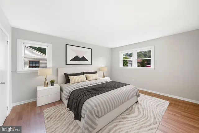 a bedroom with a large bed and a window