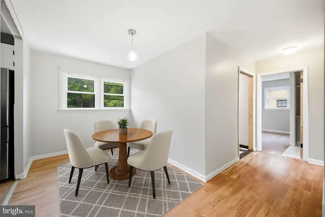 a view of a dining room with furniture and window