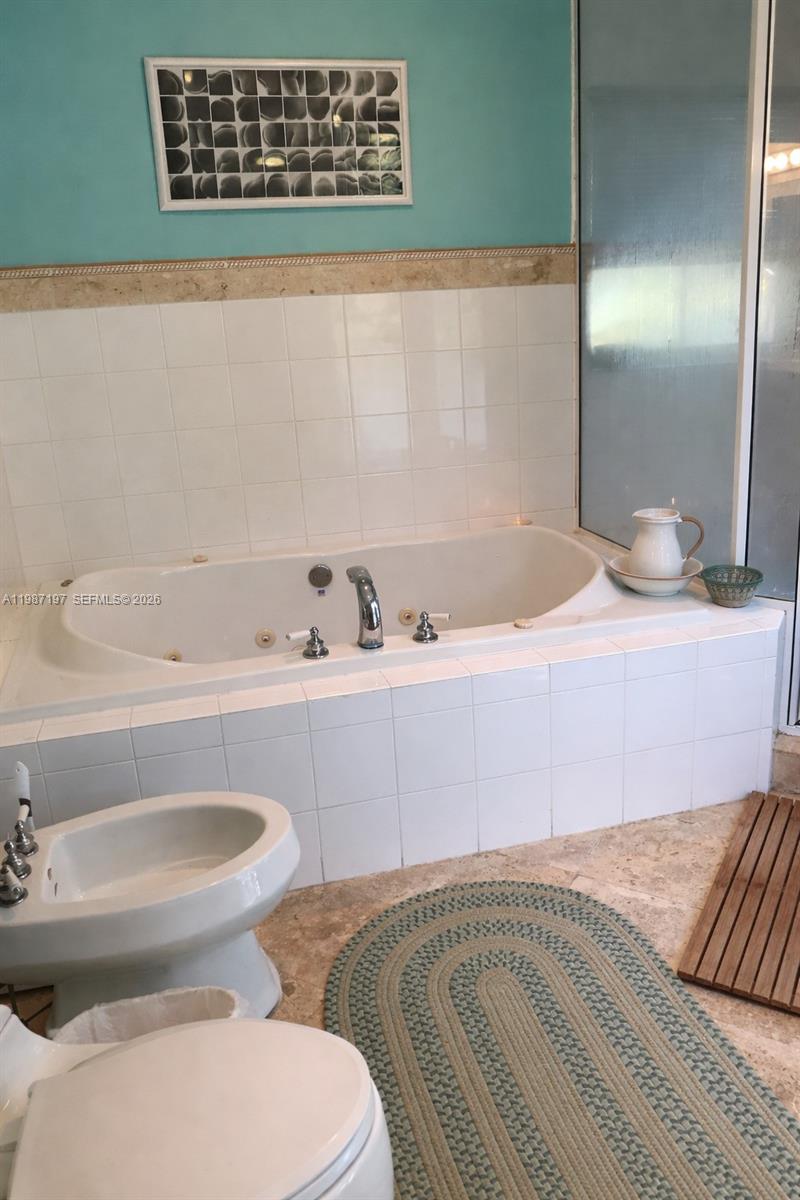 3151 Freeman Street Miami, FL 33133 - Photo 13 of 20 a bathroom with a sink and a toilet