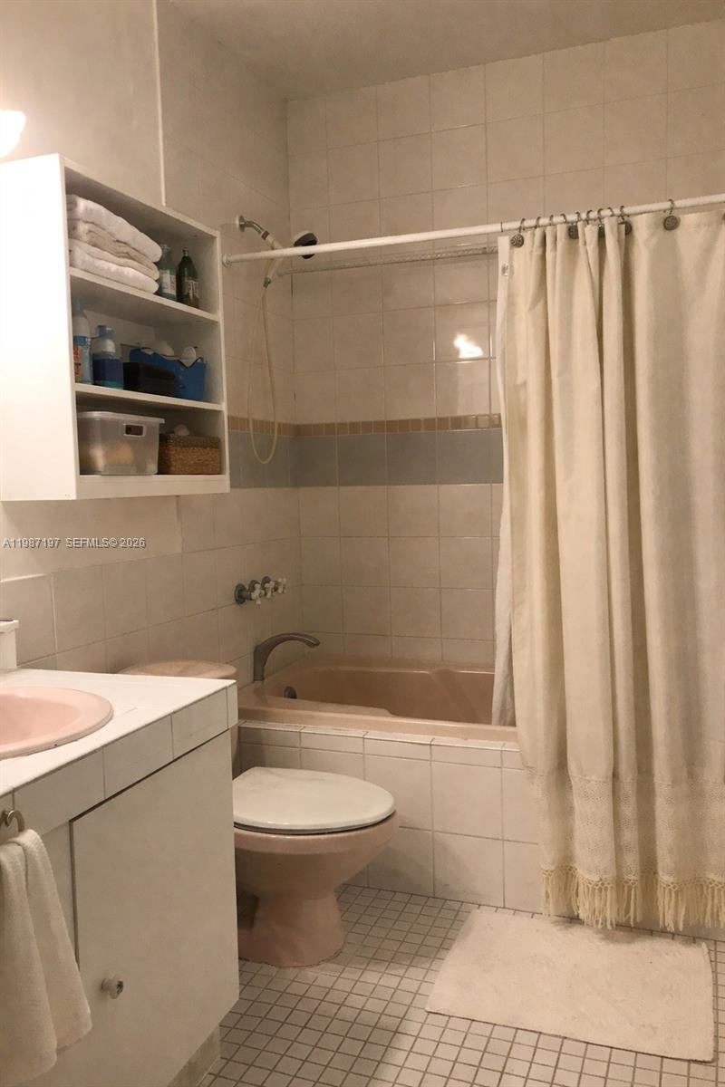 3151 Freeman Street Miami, FL 33133 - Photo 16 of 20 a bathroom with a toilet a sink and shower