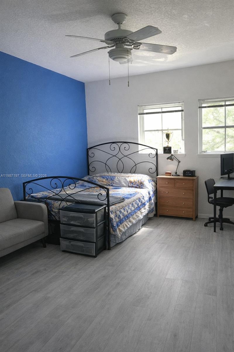 3151 Freeman Street Miami, FL 33133 - Photo 17 of 20 a bedroom with furniture and a window