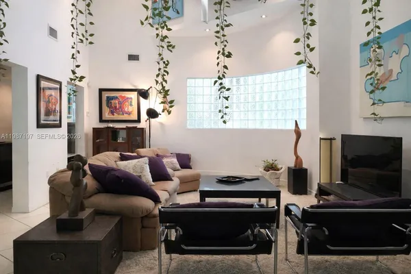 a kitchen with a sink and refrigerator