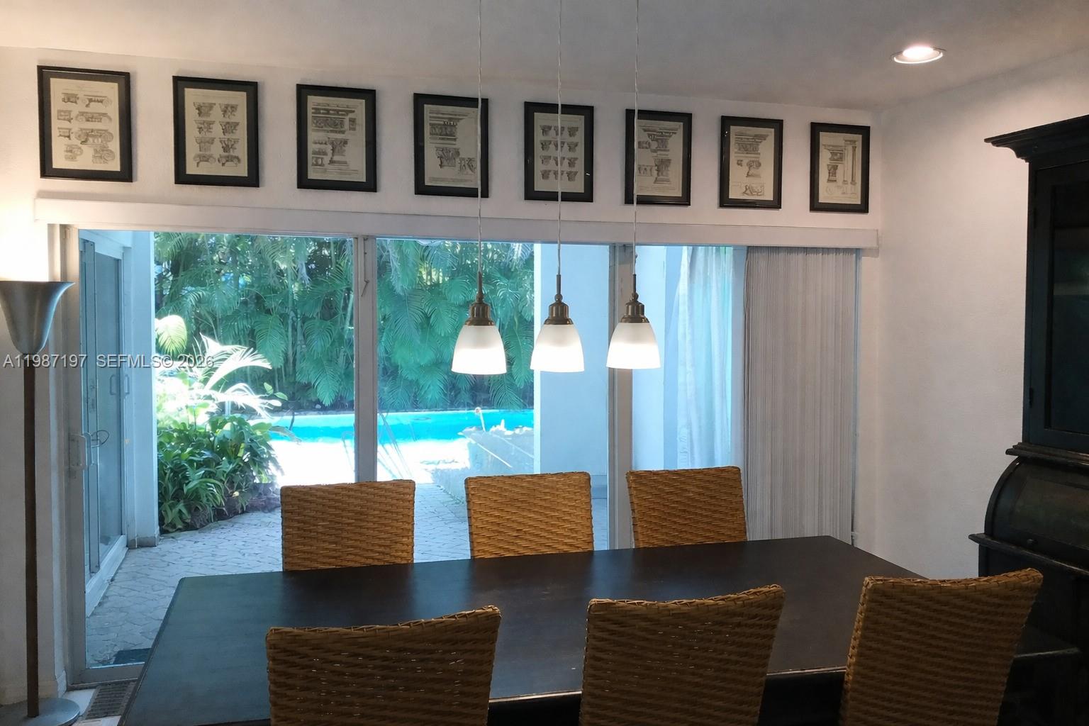 3151 Freeman Street Miami, FL 33133 - Photo 8 of 20 a living room with furniture and a window